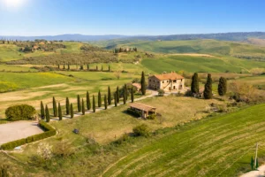 Restored stone farmhouse with panoramic views over the rolling hills of the Val d'Orcia, Tuscany
